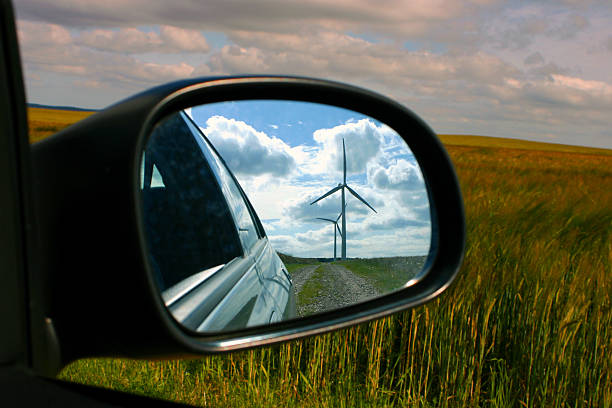 istock Windmill reflected in car wing mirror with view of fields. 90669211