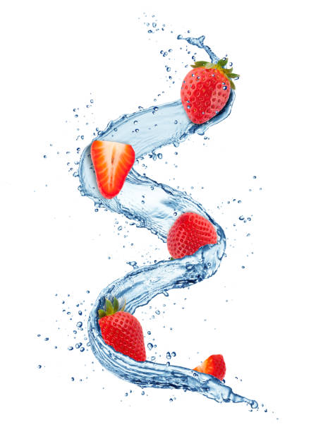 Pieces of strawberries in water splashes isolated on white background