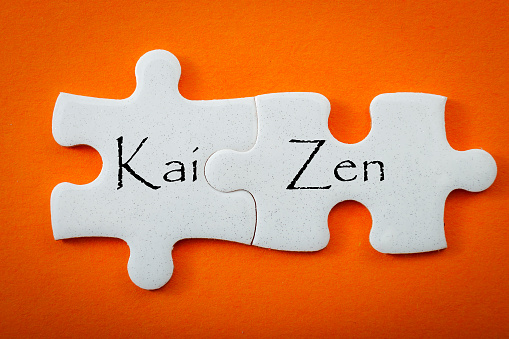 Kaizen business concept with jigsaw puzzle pieces
