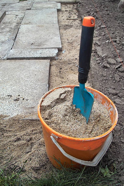 mini shovel in bucket stock photo