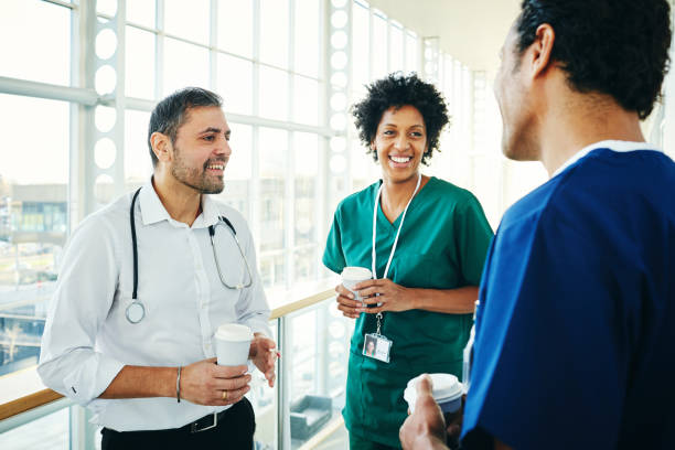 istock Team of medics during coffee break in hospital 906716372