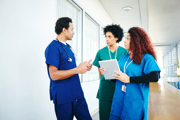 istock Team of professionals medics discussing work 906716456