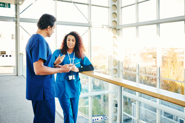istock Doctors discussing a case in hospital 906716504