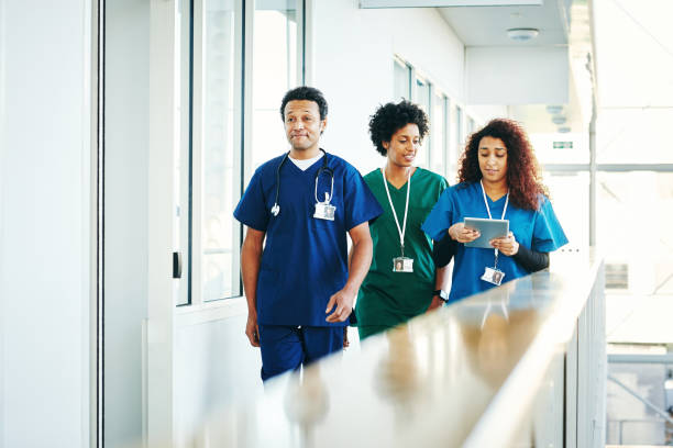 istock Medics walking along hospital corridor 906716506