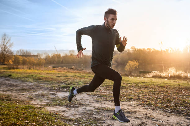 istock Young athlete running by the river 906716592