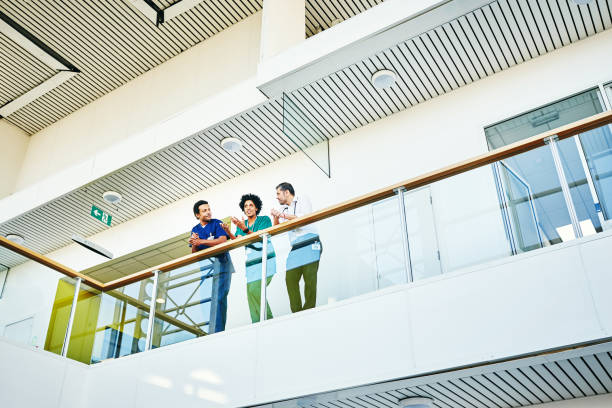 istock Professional medics standing in hospital balcony 906716694