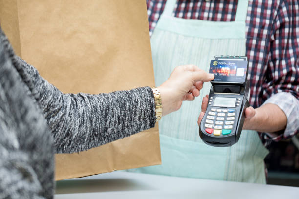 istock Senior woman paying contactless 906717182
