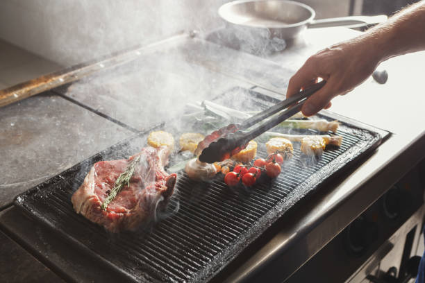 istock Chef cooking juicy beef steak at restaurant kitchen 906723734