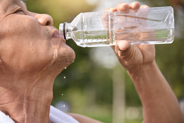 istock Asian senior male drinking water. 906724374
