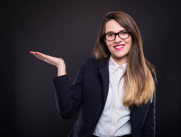 istock Smiling woman showing copy space for product 906726818