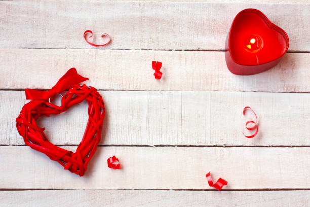 istock valentine's day background, wicker heart, candle 906731106