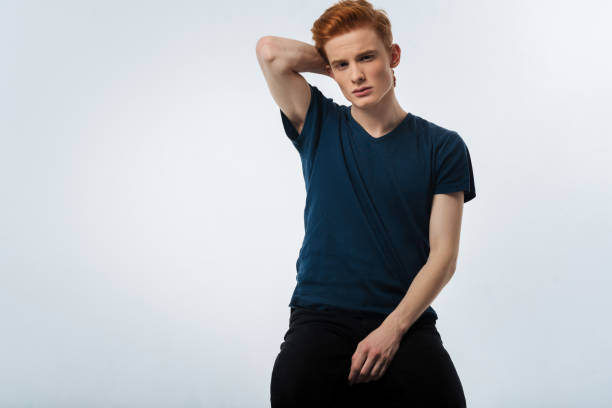 istock Serious young man having his hand on his nape 906735080
