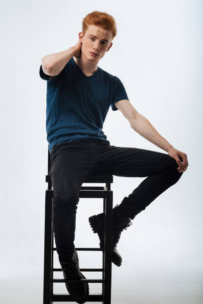 istock Concentrated man sitting on the chair and thinking 906735252