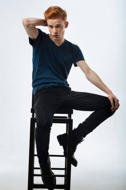 istock Earnest man sitting on the chair and pouting 906735384