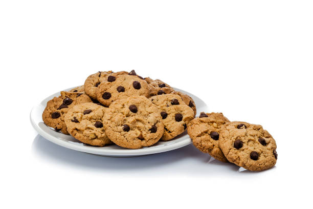 istock Homemade chocolate chip cookies plate isolated on white background 906739572
