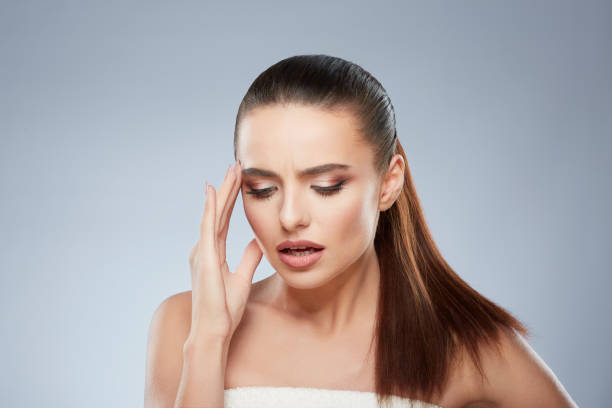 istock Tired girl looking down with pain 906741144