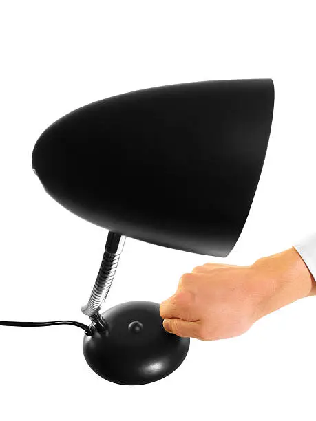 Photo of Black Desk Lamp Being Switched On