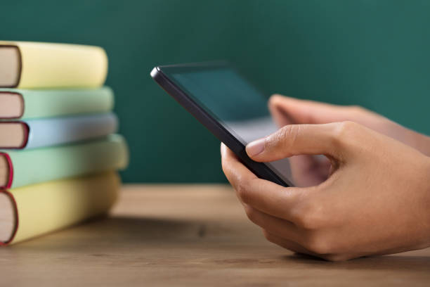 istock Close-up Of A Student's Hand Using Digital Tablet 906743560
