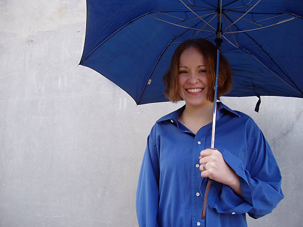 istock Smiling Girl with an Umbrella 90675547