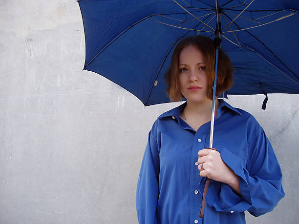 istock Girl in Blue with Umbrella 90675551