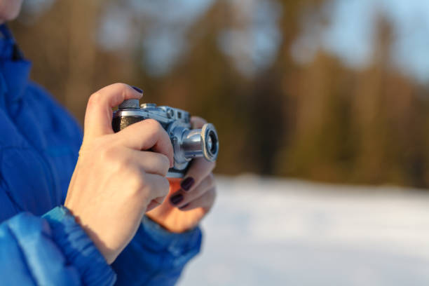 istock Old camera in hands, photography concept 906757694
