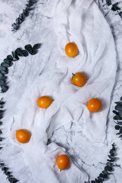istock fresh juicy kumquat in white background 906758180
