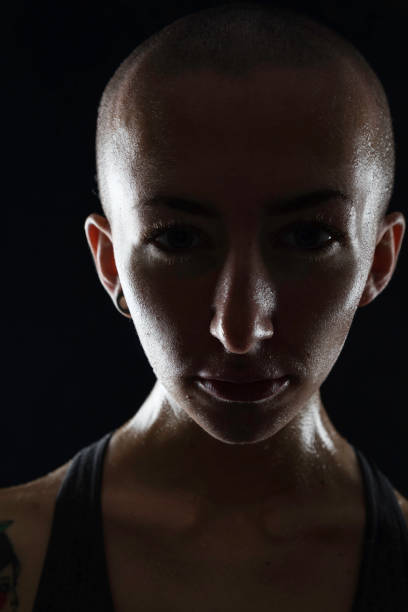 istock Bald, sweaty female athlete 906758306
