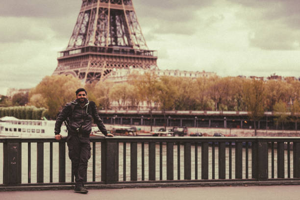 istock Happy tourist man enjoying Paris 906761662
