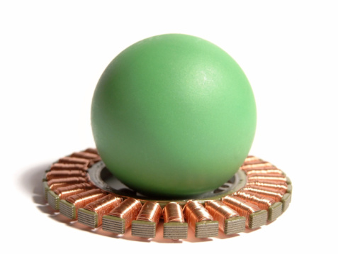 abstract part of an electro motor with green ball