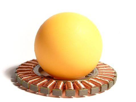 abstract part of an electro motor with yellow ball