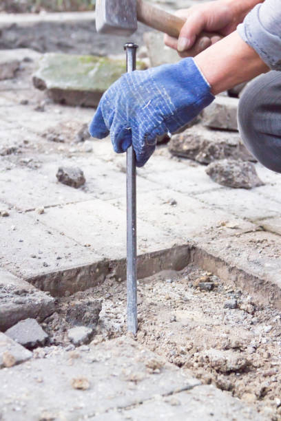 istock Workers build urban floor tiles, close-up 906761968