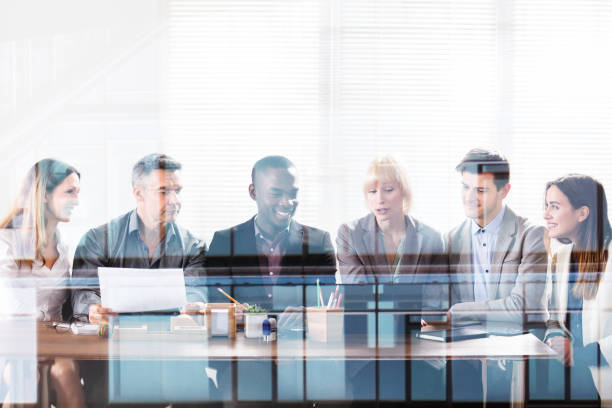 istock Businesspeople Looking At Laptop 906762516