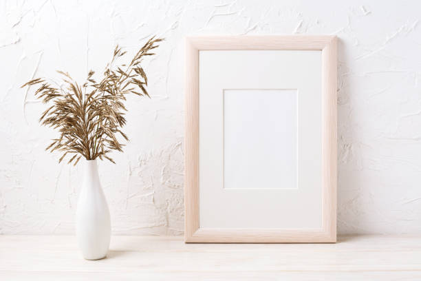 istock Wooden frame mockup with dried grass 906764820
