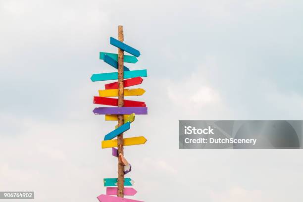 Colorful Wooden Direction Arrow Signs Stock Photo - Download Image Now - Direction, Sign, Directional Sign