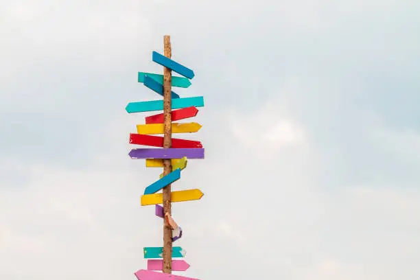 Photo of Colorful wooden direction arrow signs