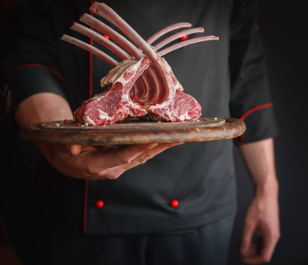 istock Raw cut rack of lamb on wooden board 906764974