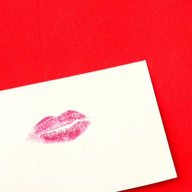 istock Card with red lips imprint on red background, square 906765316