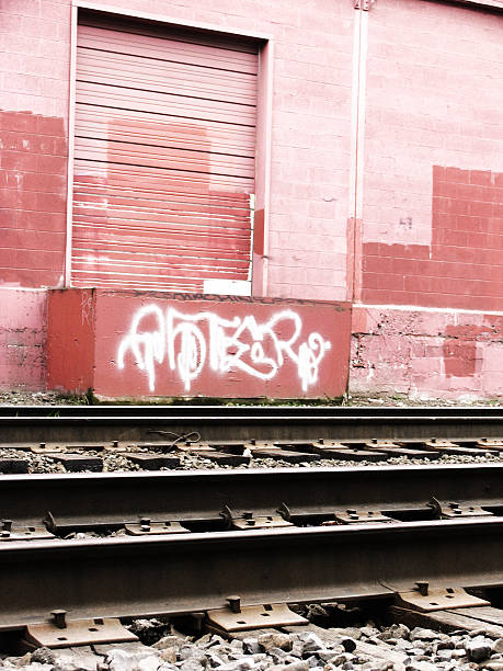 istock Old Train Tracks and Light Pink Wall with Door 90676754