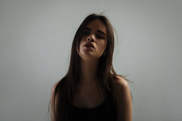 istock Attractive dark-haired young woman staring 906768390