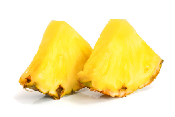 istock pineapple slices isolated on white background close-up 906768724