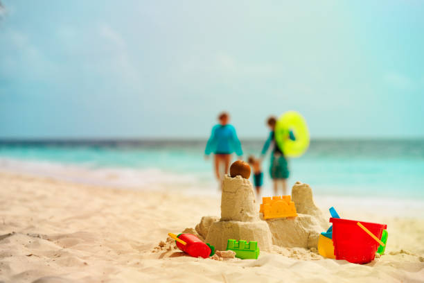 istock sand castle on tropical beach, family vacation 906769688