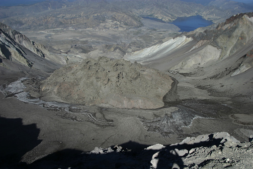 The view from the rim of mount St Helens before the latest eruptions, showing the lava dome from the 1980 eruption, the blast zone and Spirit Lake in the background.