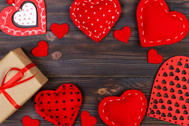 istock Valentines day greeting card. Handmaded hearts on wooden table. Top view, copy space 906772746