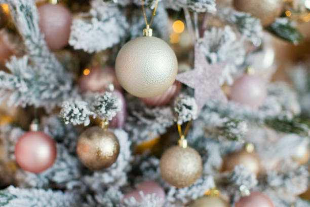 istock Christmas tree with golden and pink decorations 906773048