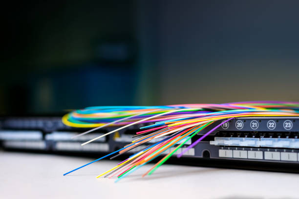 fibre optic cables on patch distribution panel - splice imagens e fotografias de stock
