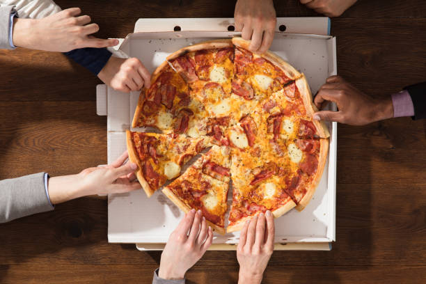 istock Hands Taking Each Slice Of Pizza 906777418