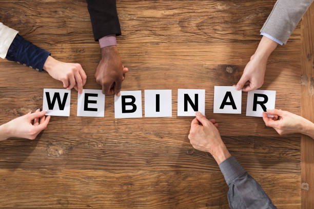 istock Businesspeople Hands Arranging Webinar Word 906777468