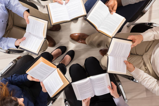 istock Group Of Diverse People Reading Books 906777492