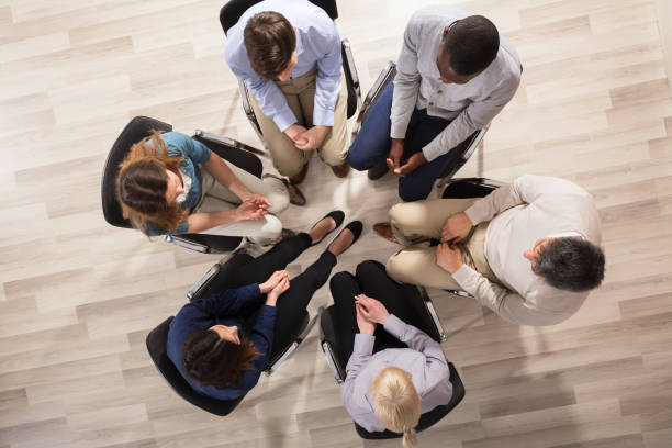 istock Group Of People Sitting On Chair In Circle 906777562