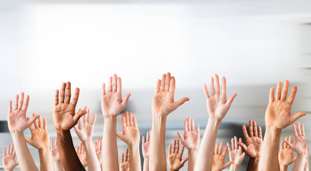istock Close-up Of Raised Hands 906777636